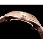Navigator series men's watch with chocolate dial, rose gold bezel, 42mm case, and rose gold five-link bracelet.